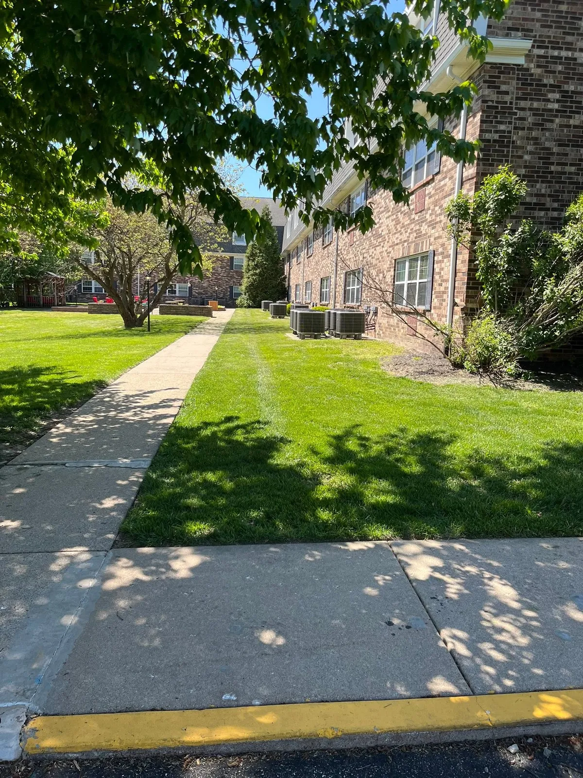 Heyen Lawn Service mowing crew at work
